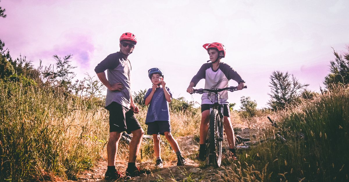 Family cycling through the countryside