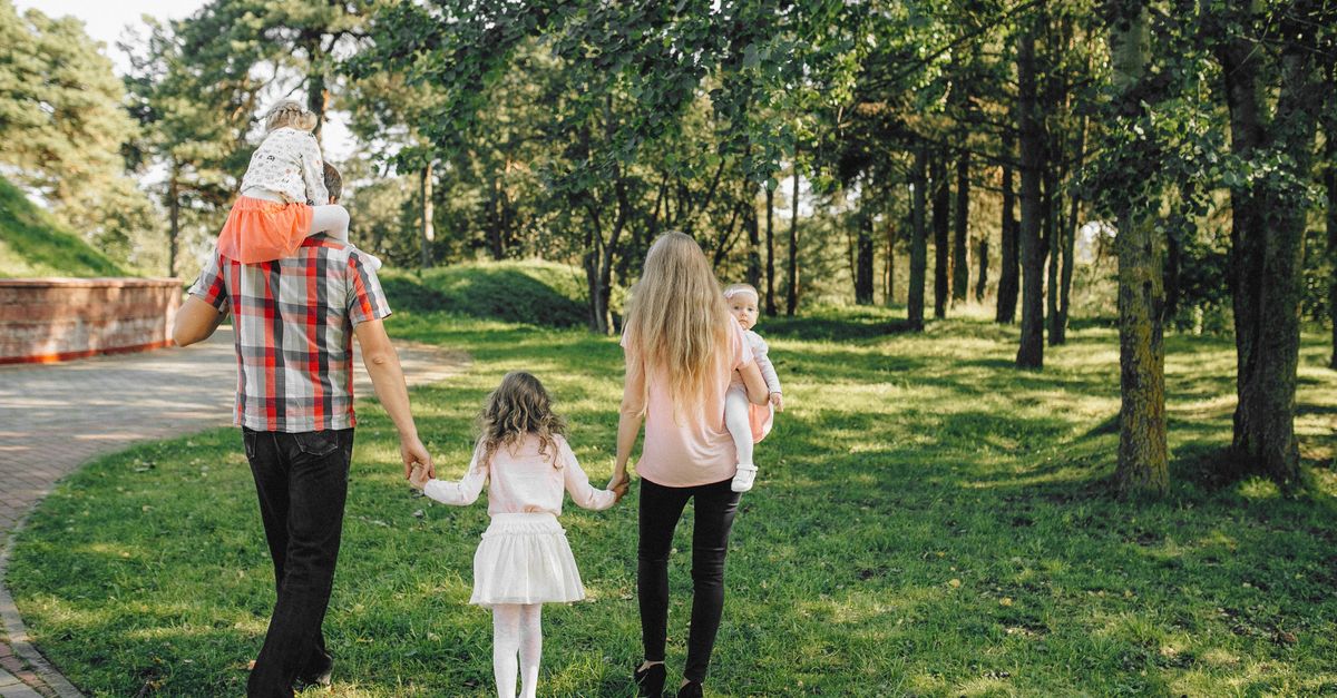 Family walking through a park